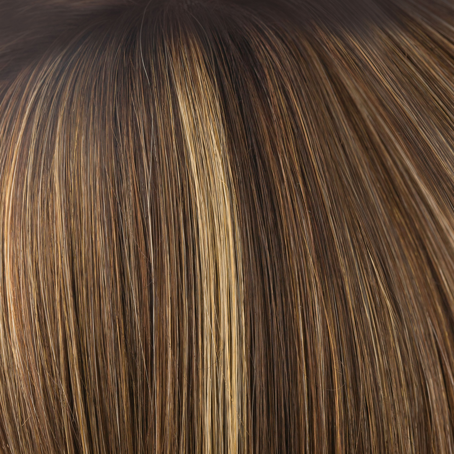 Almond Rocka-R - Cappucino-based, with a mix of dark strawberry blond and medium golden blond highlights with deep brown roots