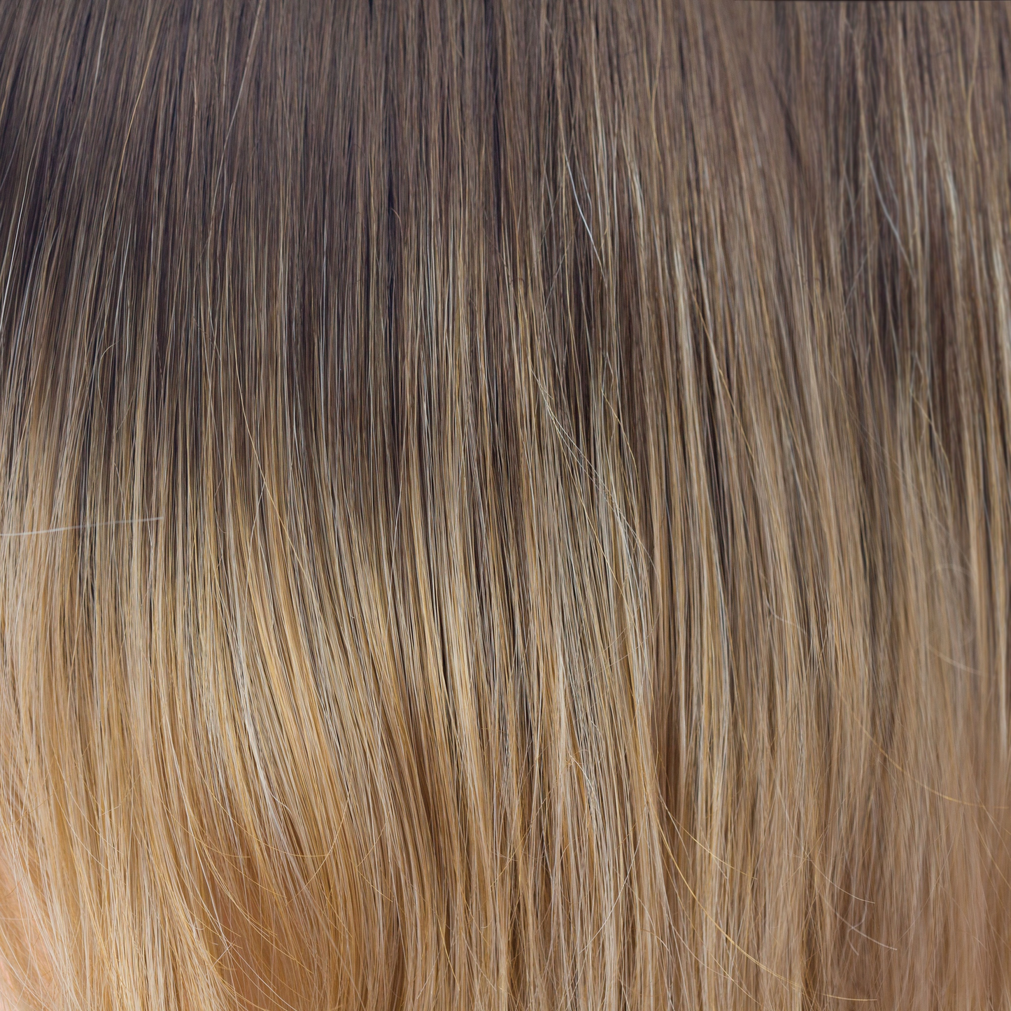 Banana Split-LR - A long chocolate root which blends into golden yellow slices with banana blonds running toward the ends. A flattering ombre that enriches your complexion.