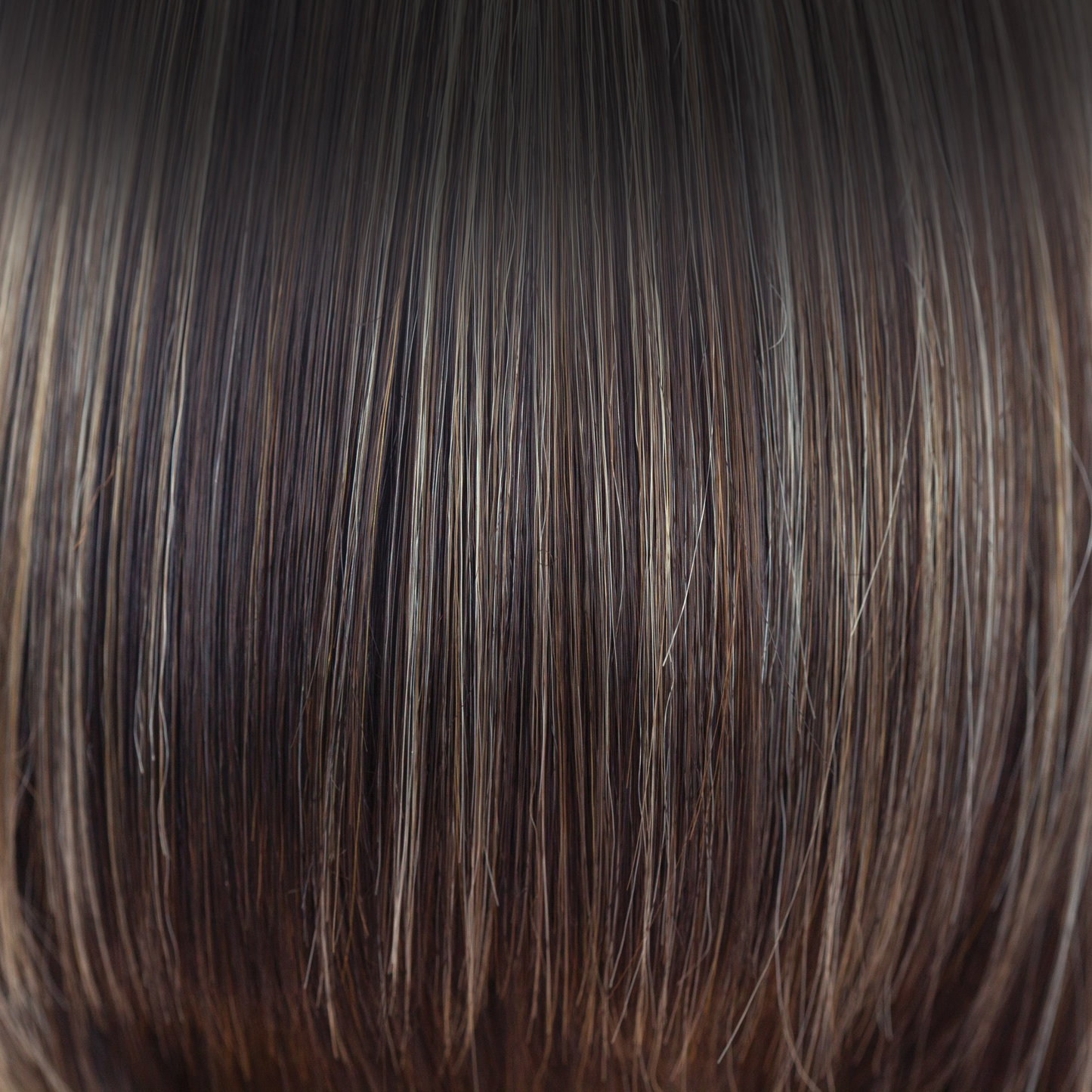 Chocolate Frost-R - The rooted version of Chocolate Frost-R brings soft warm medium brown base tones, splashed with a blend of cool light blond and dark warm blond highlights. The addition of neutral dark brown roots creates a modern yet realistic appearance.