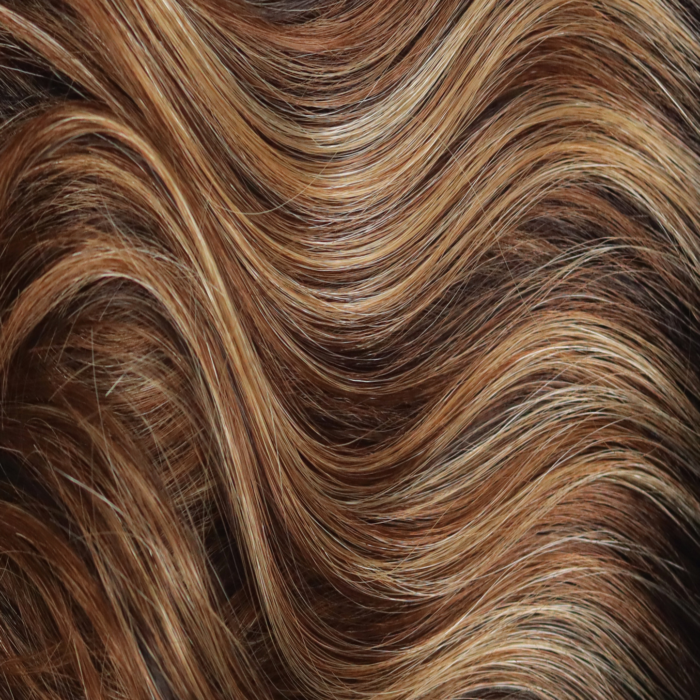 Chocolate Pretzel - A swirly delight as it combines a dark brown base with a delightful cascade of medium honey blond and medium coppery highlights. Empower any look with this modern brown color.