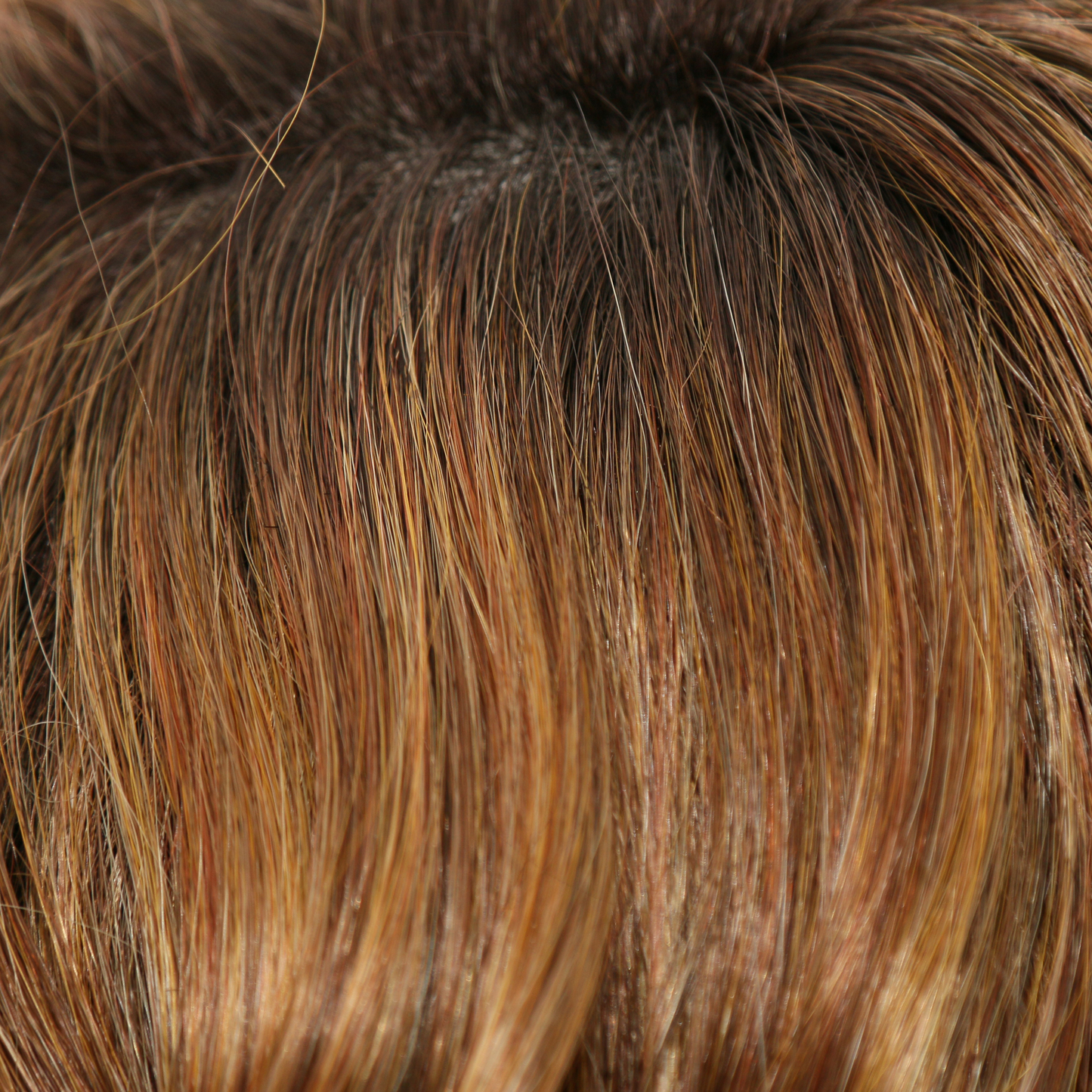 Honey Brown-R - A summery, rooted color that blends a sunkissed, medium brown base blended with medium honey blond highlights. The dark brown roots are added for a natural shadowed effect and warm tone that enhances the skin tone.