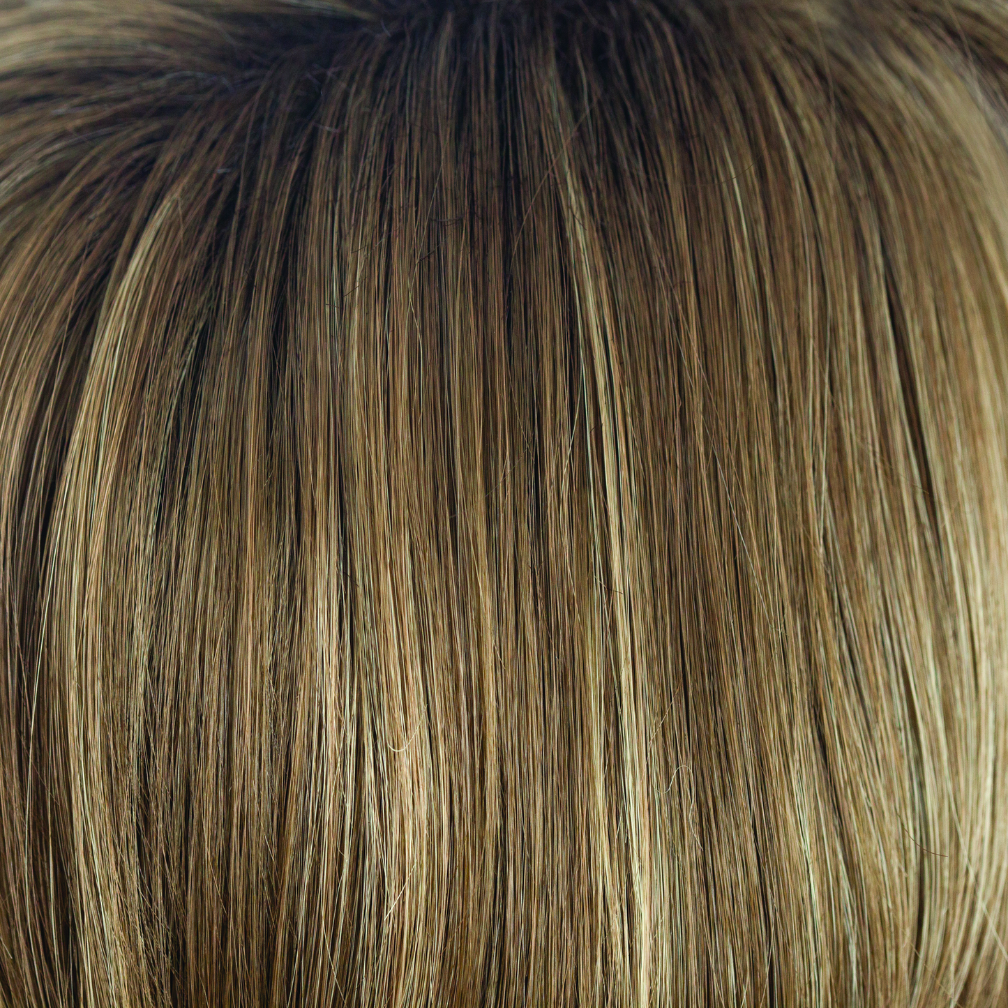 Honey Wheat-R - This wheaty rooted wonder suites all ages and skin tones. The chocolate brown root of Honey Wheat-R has regrowth graduates into the mid lengths and ends. Full of gentle slices of honey cream and blond wheaty tones.