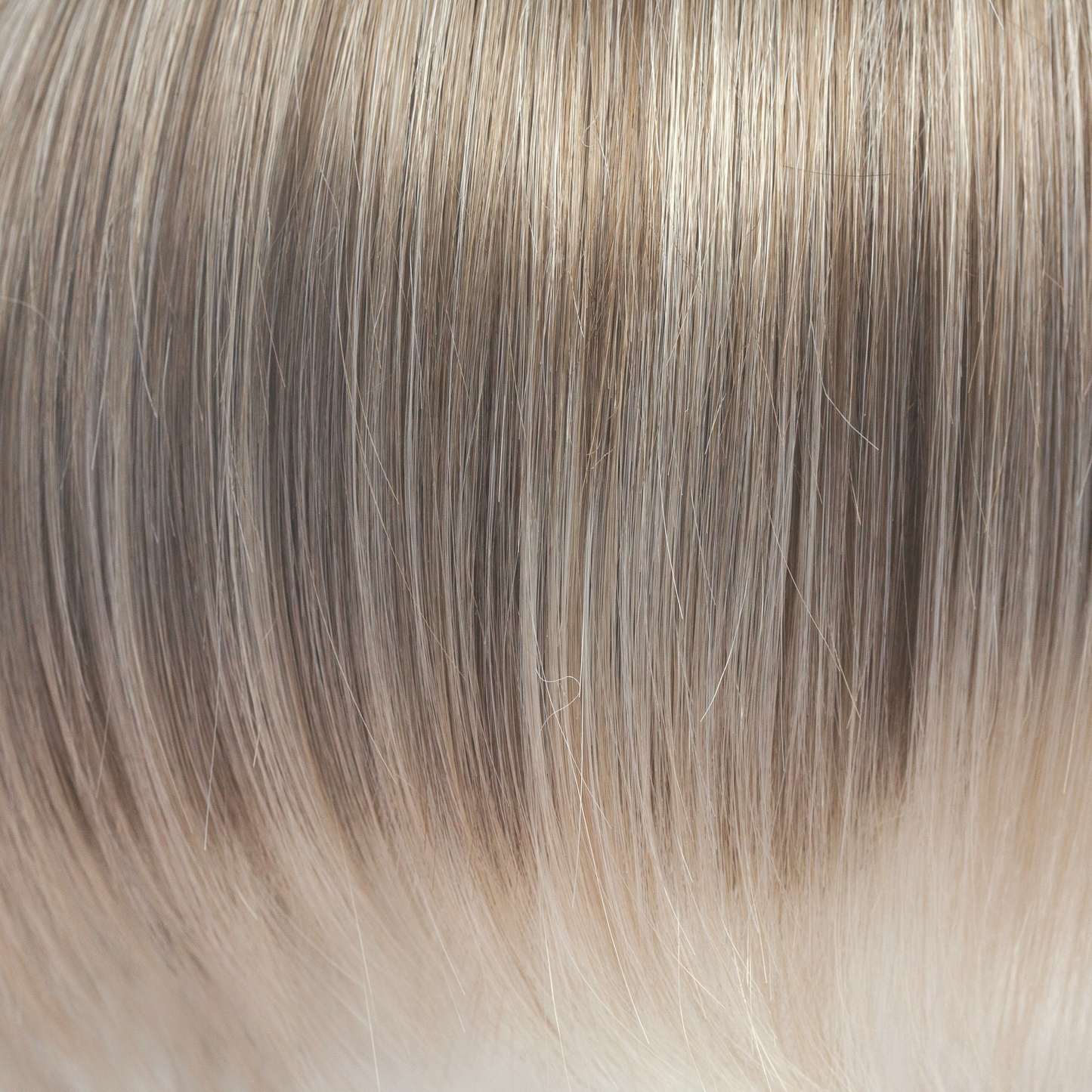 Ice Blond - This captivating clever color has a blend of beautiful ash blond highlights and velvet blonds. Towards the ends of the hair you are hit with blocks of ice blonde tips. This Ice Blond color combination is great in any style. It is crisp and cool… we love it!
