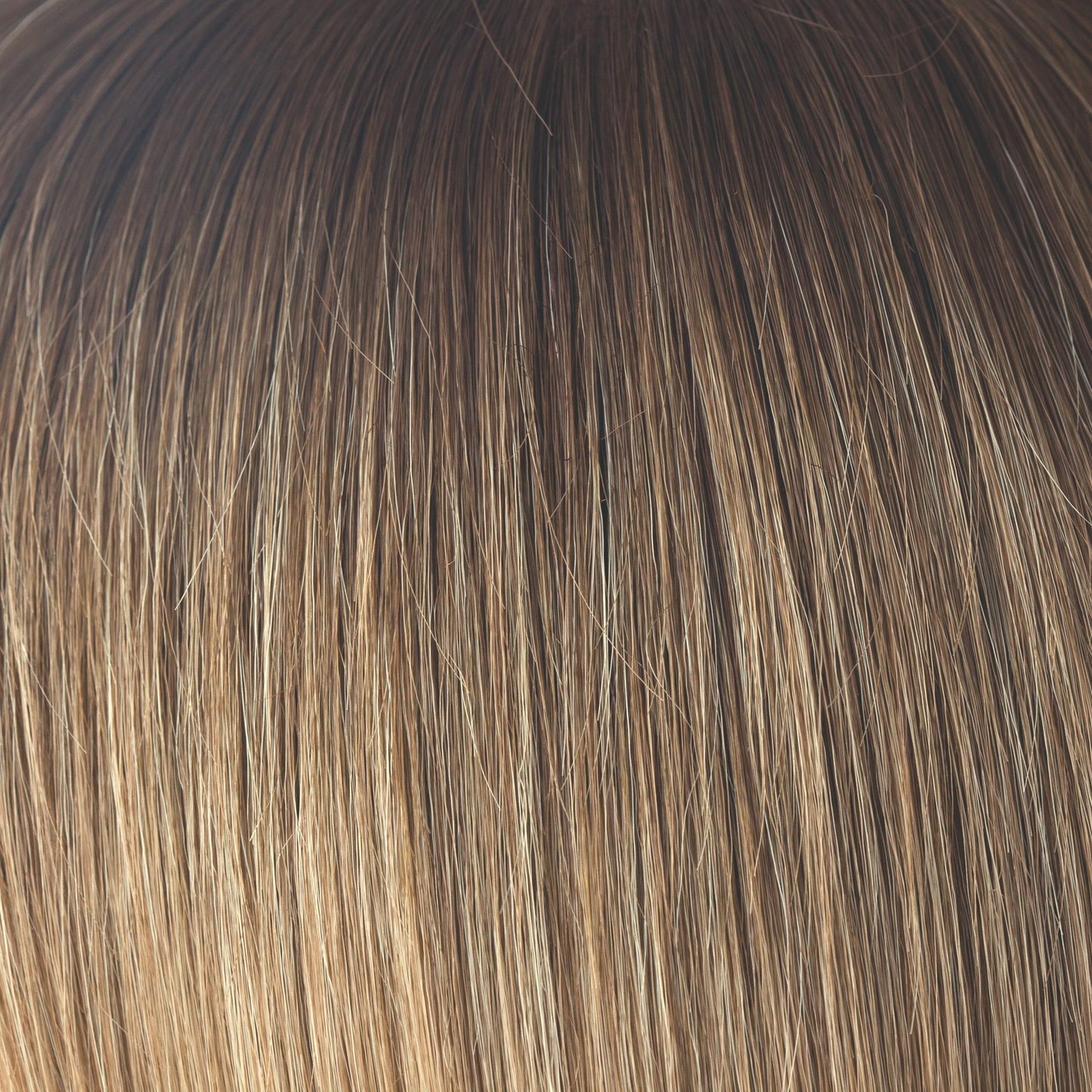 Macadamia-LR - The warm rich ombre of the macadamia brown roots blend through into soft, golden blond and walnut cream slices. With a luxury, velvet finish, Macadamia-LR looks great in long and mid length styles.