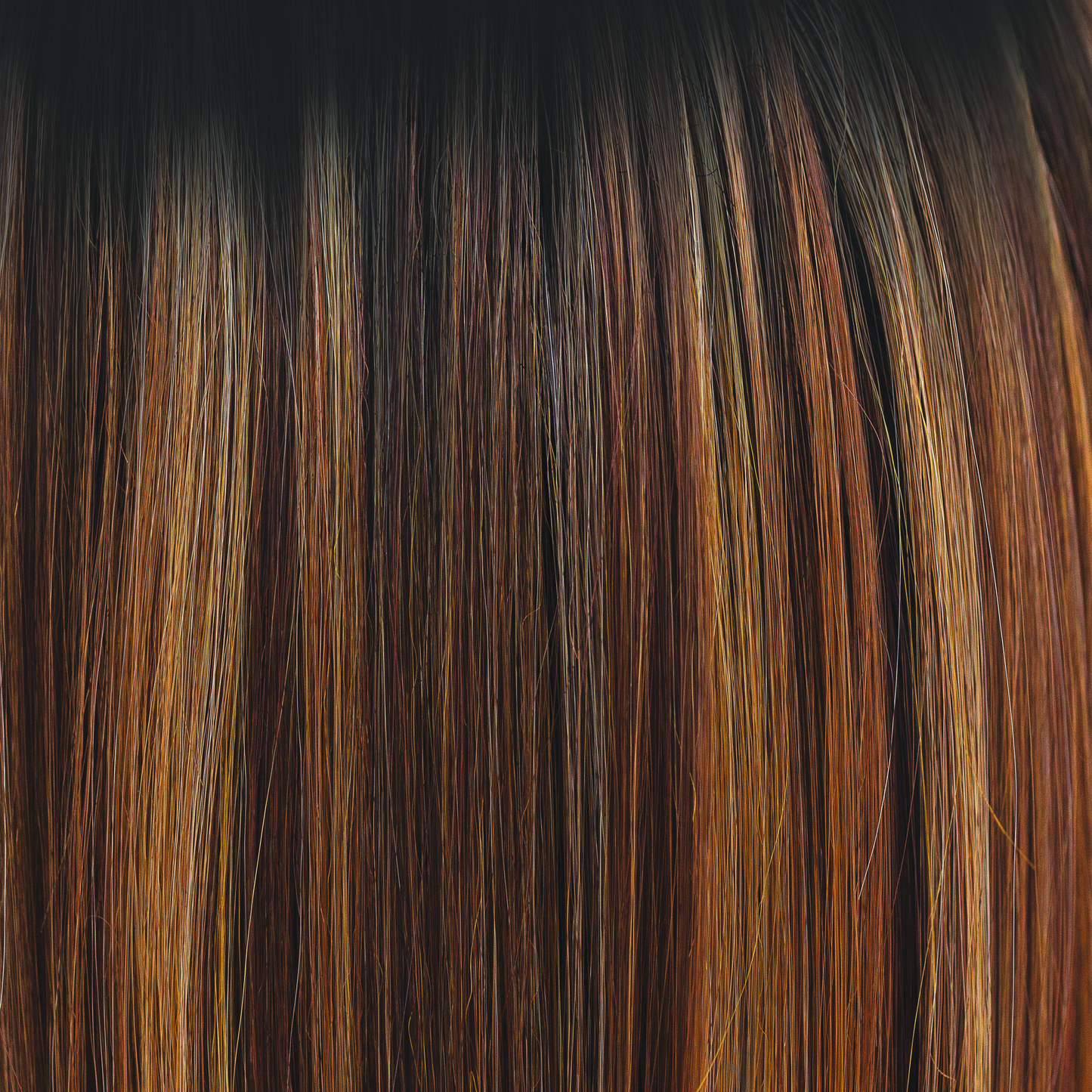 Molten Amber - A dark brown rooted color blending into chestnut and deep copper tones, with flecks of creamy golden fine blonds. Simply stunning and very wearable. Molten Amber oozes class and is a high heat color.