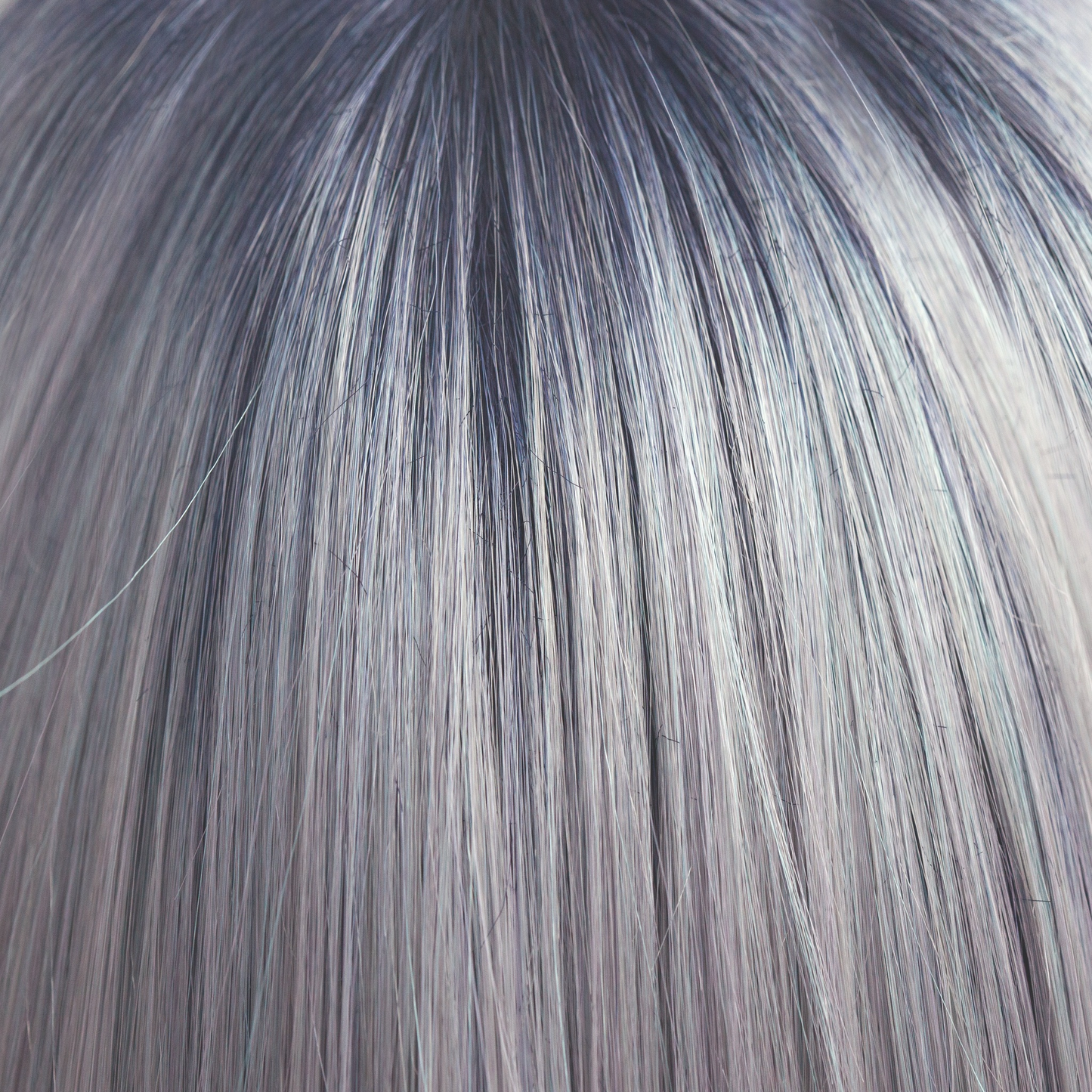 Pastel Blue-R - A cool pale pastel blue with hues of white. This Pastel Blue-R color has the palest of mineral blue highlights and silver shadows graduating from a dark blue sapphire root giving depth and definition.