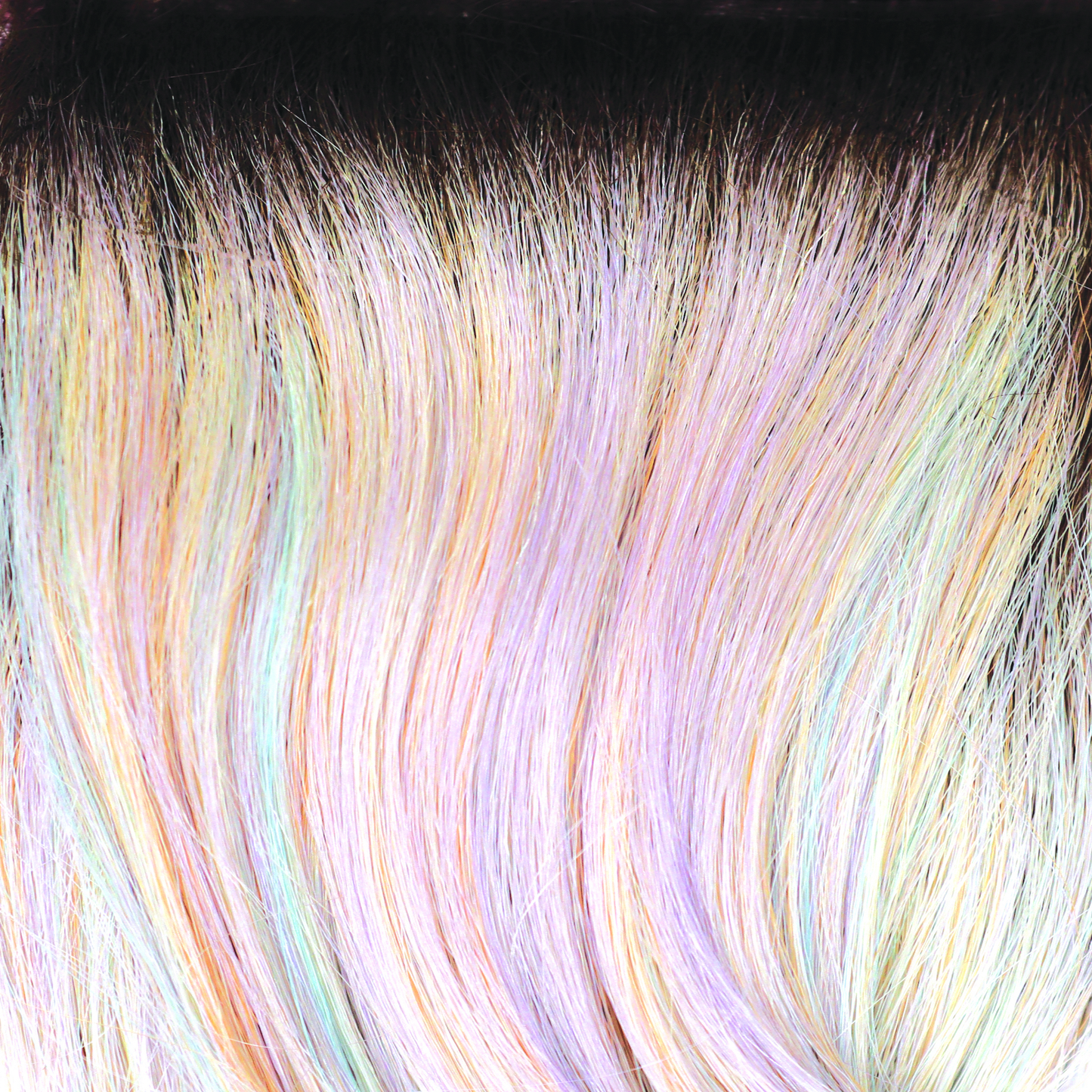 Pastel Rainbow-R - At first glance, this looks like a brilliant medium brown rooted blond, then it pops like a concerto of colored sunbeams with the palest of peaches, limes and lilac pinks. Pastel Rainbow-R is full of surprises.