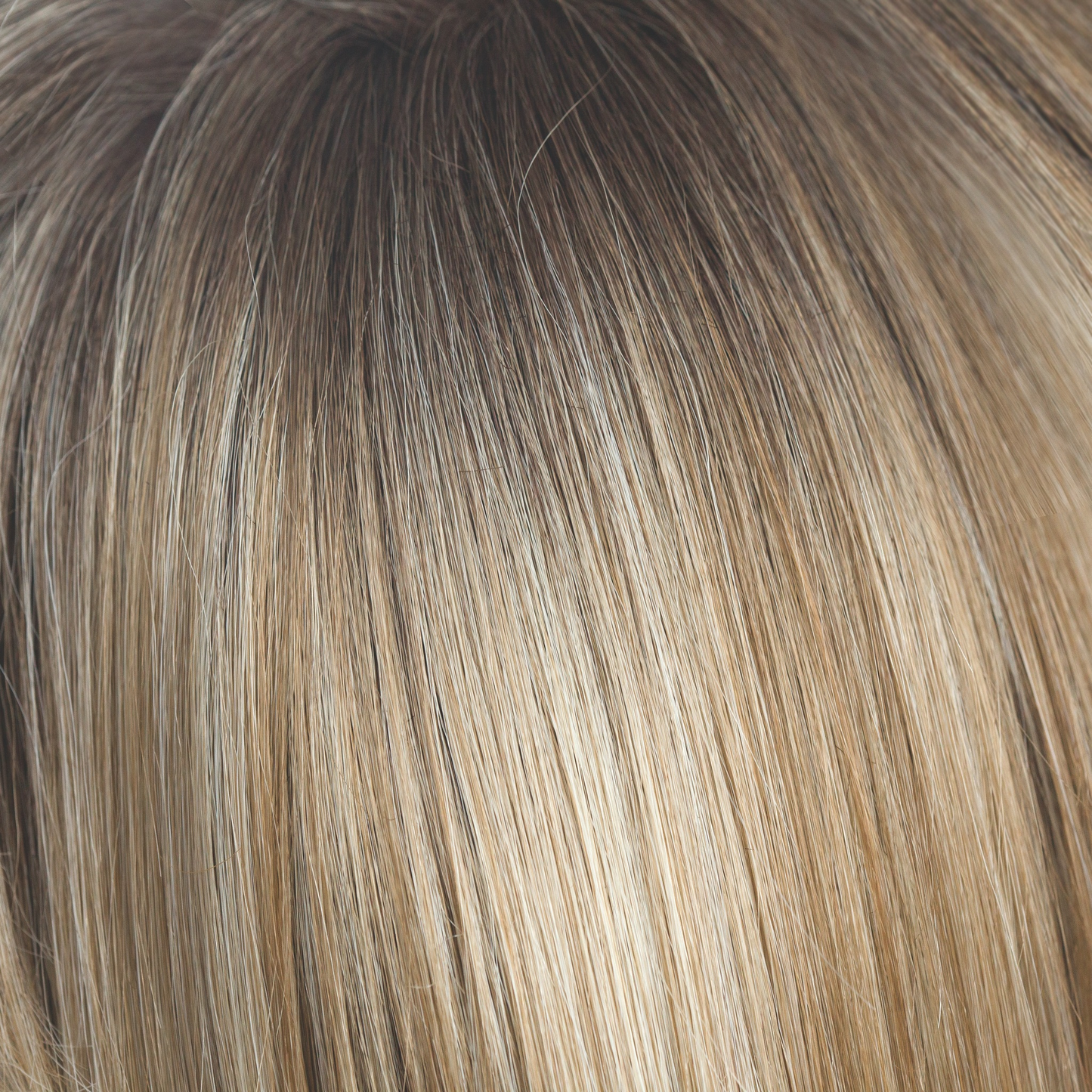 Rose Gold-R - A medium to dark golden brown and blends into the rose gold blond with rooted blond and hints of rose and hues of peachy coral.