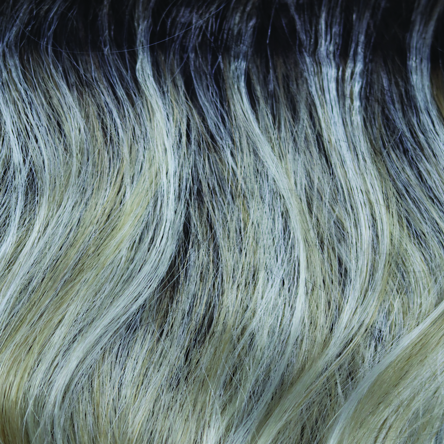 Shadowed Custard - This medium toffee rooted blond is packed full of weaves of custard cream slices and caramel undertones.