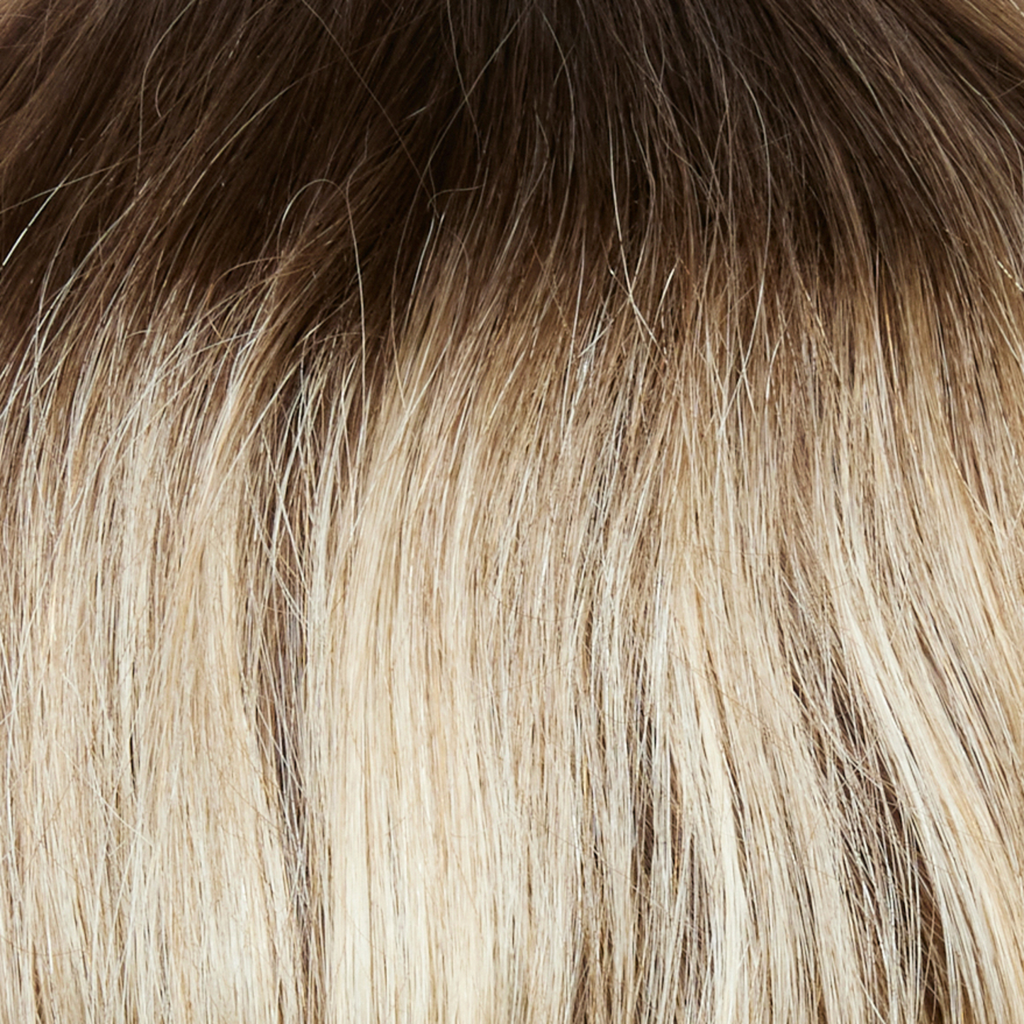 Spring Honey-LR - A natural regrowth with a medium gold honey brown root combined with a mixture of white blonde highlights and strawberry blonds.